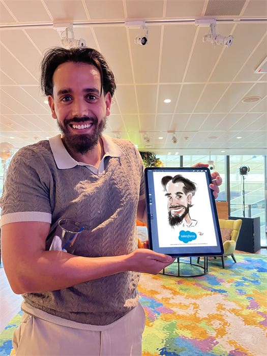 Guest proudly showing his live caricature at a corporate event