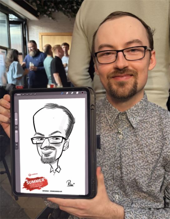Guest in glasses with his live digital caricature